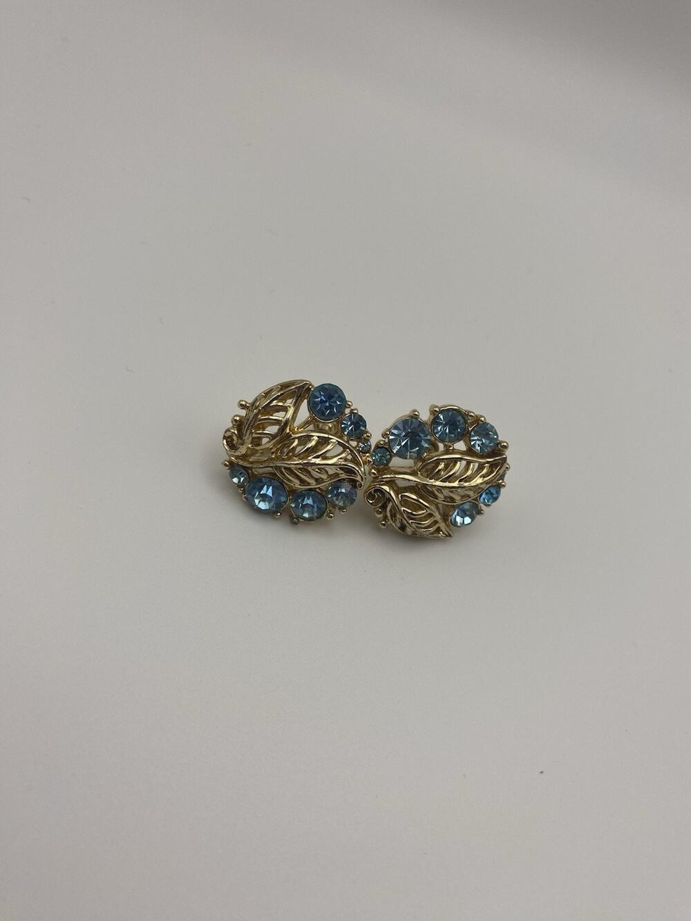 Vintage Baby Blue Rhinestone Gold Tone Leaf Design screw back 1" Earrings